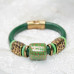 Комплект браслетов из зеленой кожи и Нефрита Комплект браслетов из зеленой кожи и Нефрита